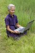 Old Asian with laptop