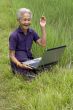 Old Asian with laptop