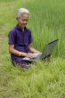 Old Asian with laptop