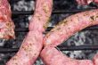 Several sausages cooked in a barbecue