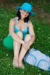 Beautiful girl sitting in a beautiful green meadow