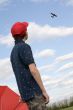boy looking at plane