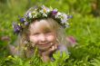 happy little girl on green meadow
