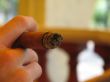 male hand holding a cigar
