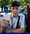elderly man with beer