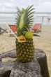 Pineapple, cocktail on the beach