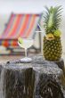 Pineapple, cocktail on the beach