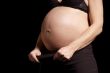 woman show pregnant belly