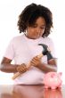 Girl with hammer and money box