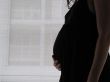 belly of a pregnant young woman