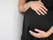 belly of a pregnant young woman