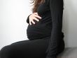 belly of a pregnant young woman