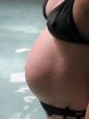 belly of a pregnant young woman