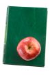 Apple red on a green book