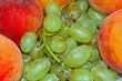 appetizing bunch of grapes and peach