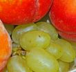appetizing bunch of grapes and peach