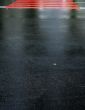 drops of rain water on a fresh asphalt