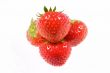  Four isolated juicy strawberries