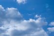 blue sky with clouds and the moon