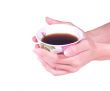 Female hands hold a coffee cup