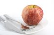 cutlery and an apple