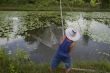 Fisherman with stave, Asia