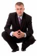 businessman sitting against white background