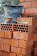 Bricks stacked, trowel and cube in the work
