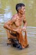 Fisherman of Thailand with throw net