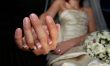 Hand of the groom and the bride