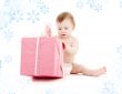 baby boy in diaper with big gift box