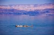 Man floating at the Dead Sea