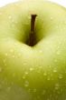 Macro of green delicious apple with reflection