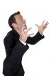 young businessman yelling with raised arms