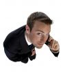 businessman busy on phone call and looking upwards