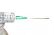 Drop on a syringe needle.