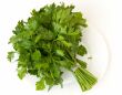 Fresh green parsley a white plate
