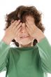 Boy with his hands covering the eyes