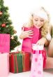  santa helper girl with gifts and christmas tree