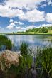 River under blue sky with clouds