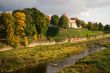 Old castle at river in sunset