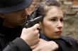 man threatens the woman with a pistol