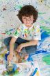 Little boy playing with painting