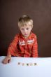 The little boy studies to consider