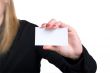 The girl holds a card in hands