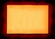 piece of yellowed paper on red