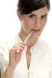 lady with pen in her mouth
