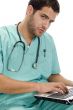 doctor with laptop and stethoscope