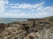 Kind from rocky high coast on ocean open spaces
