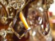 Crystal suspension bracket on an ancient chandelier in the Frenc